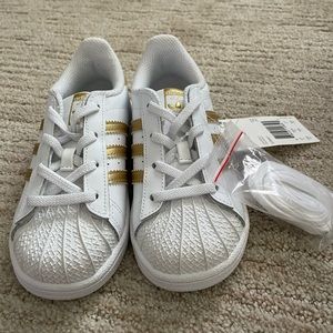 Gold and white superstar adidas for girls never worn